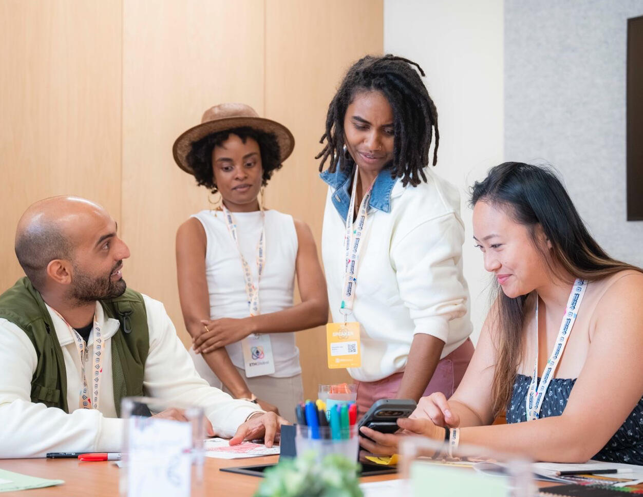 Artist shanelle julia rosita leading a participatory Loop + Line art activation with attendees at ETHGlobal in 2026.