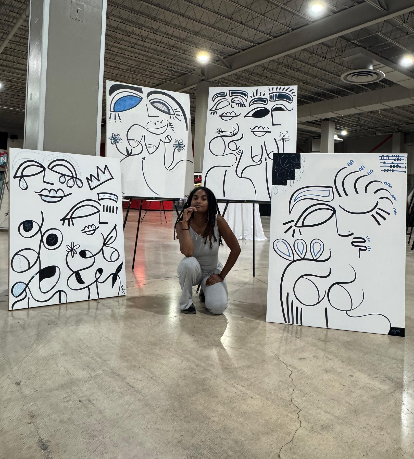 Installation view of shanelle julia rosita’s 2025 Channel Nostalgia collection during Miami Art Week, featuring large abstract line drawings displayed throughout the exhibition space.